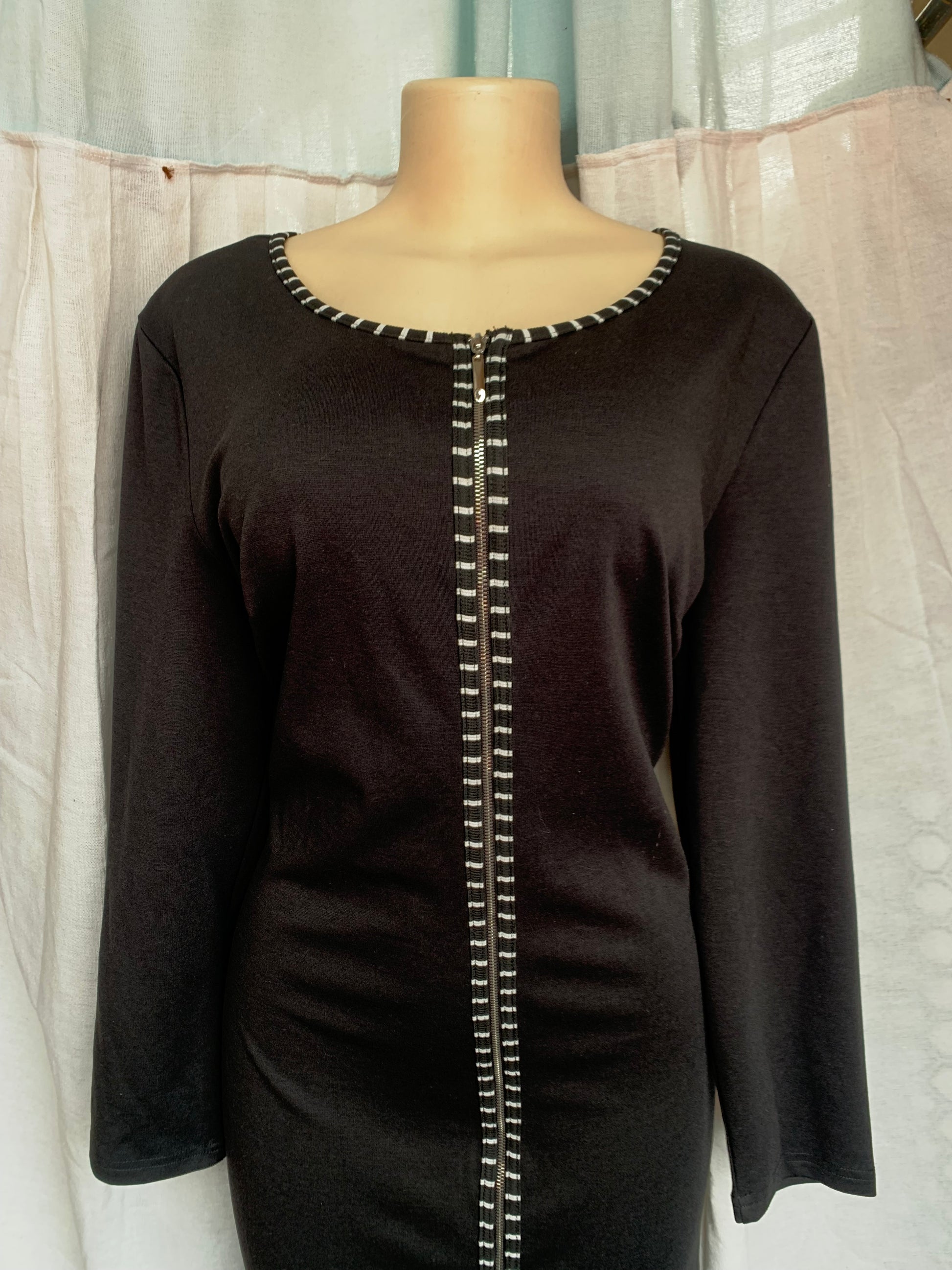 Black long sleeve professional dress with black and white zip center detail lll