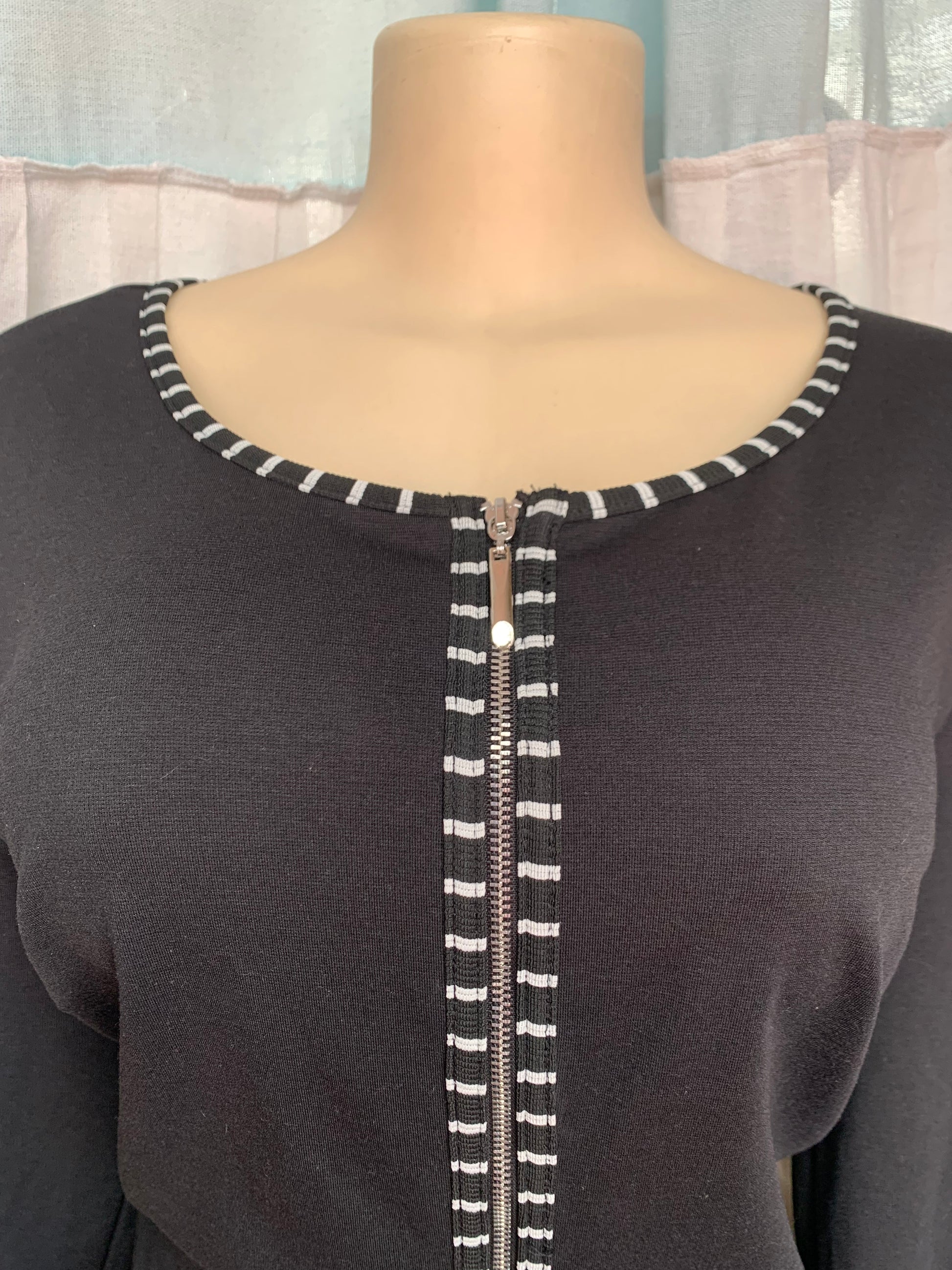 Black long sleeve professional dress with black and white zip center detail lll