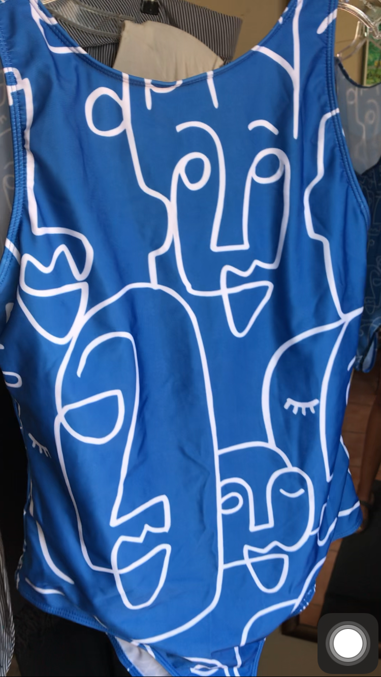 Like new sea blue squiggle faces one piece swim suit /xl
