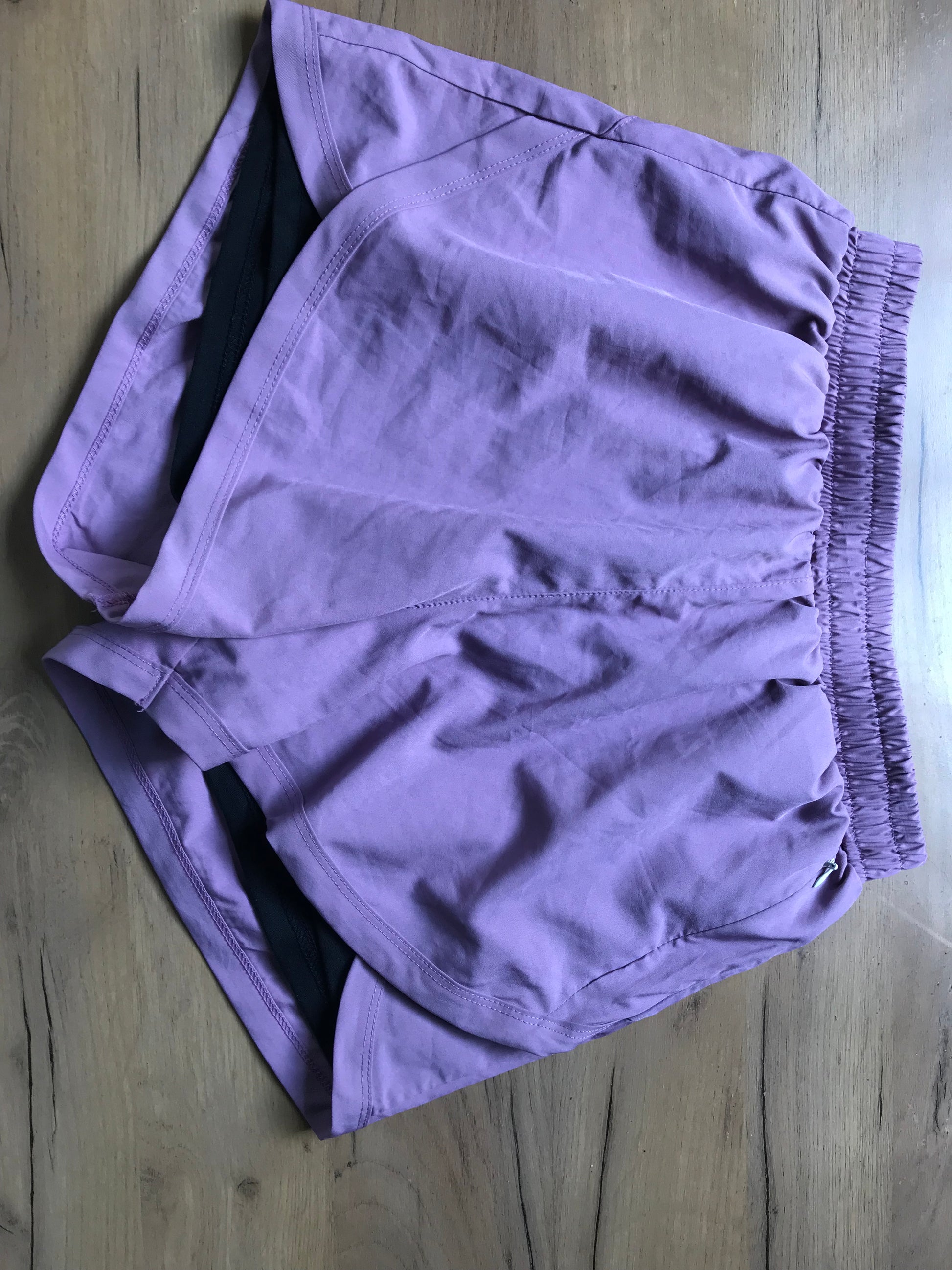 new purple exercise shorts lined . M