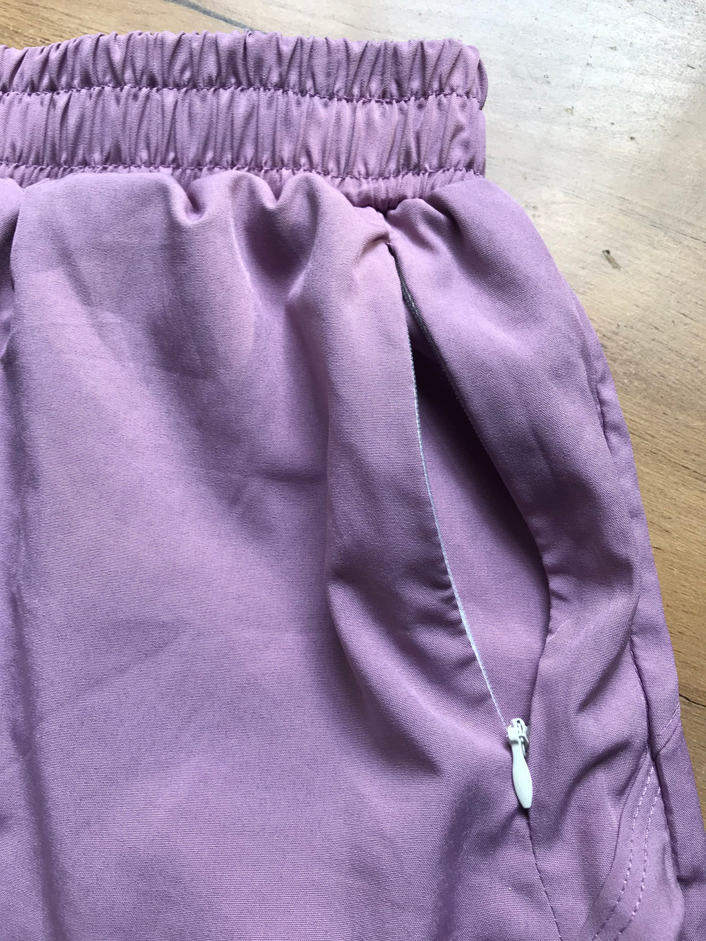 new purple exercise shorts lined . M
