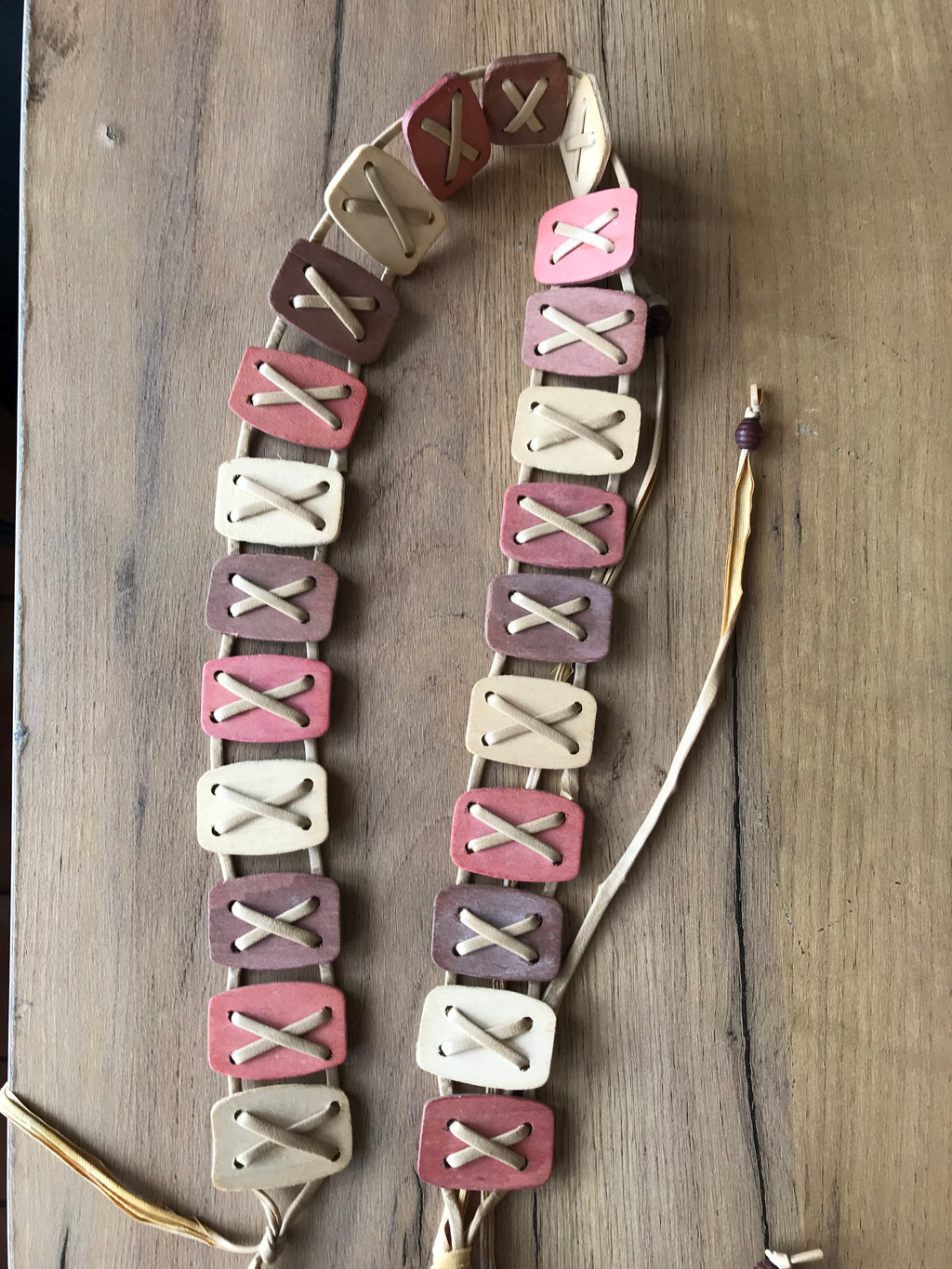 Vintage blush pastel wooden belt tied