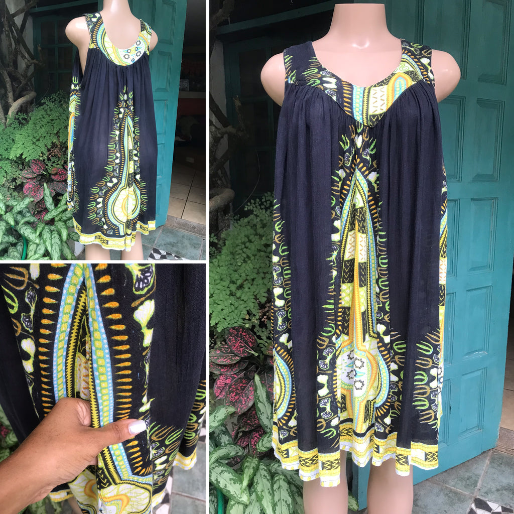 black free flowing african print dress with pockets . one size