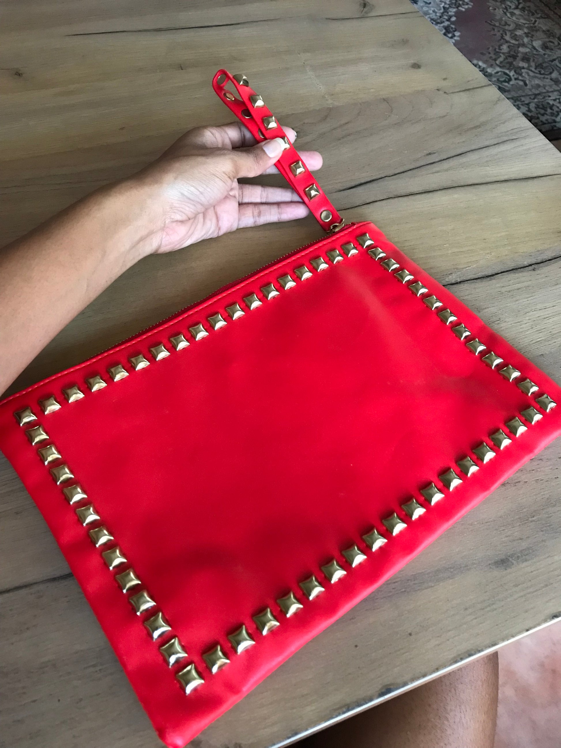 red studded large clutch bag