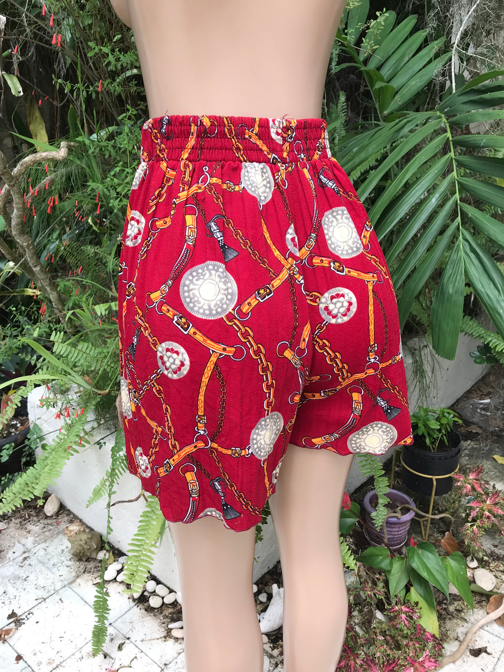 red ornate print pleat high waist shorts . s