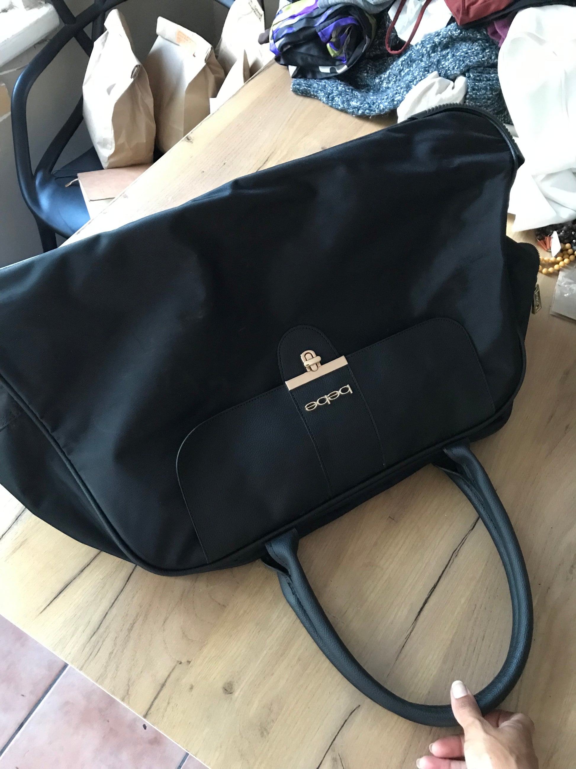 Bebe black rolling travel bag pink interior