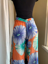 Load image into Gallery viewer, New sheer floral print pants with front slits says small can fit M
