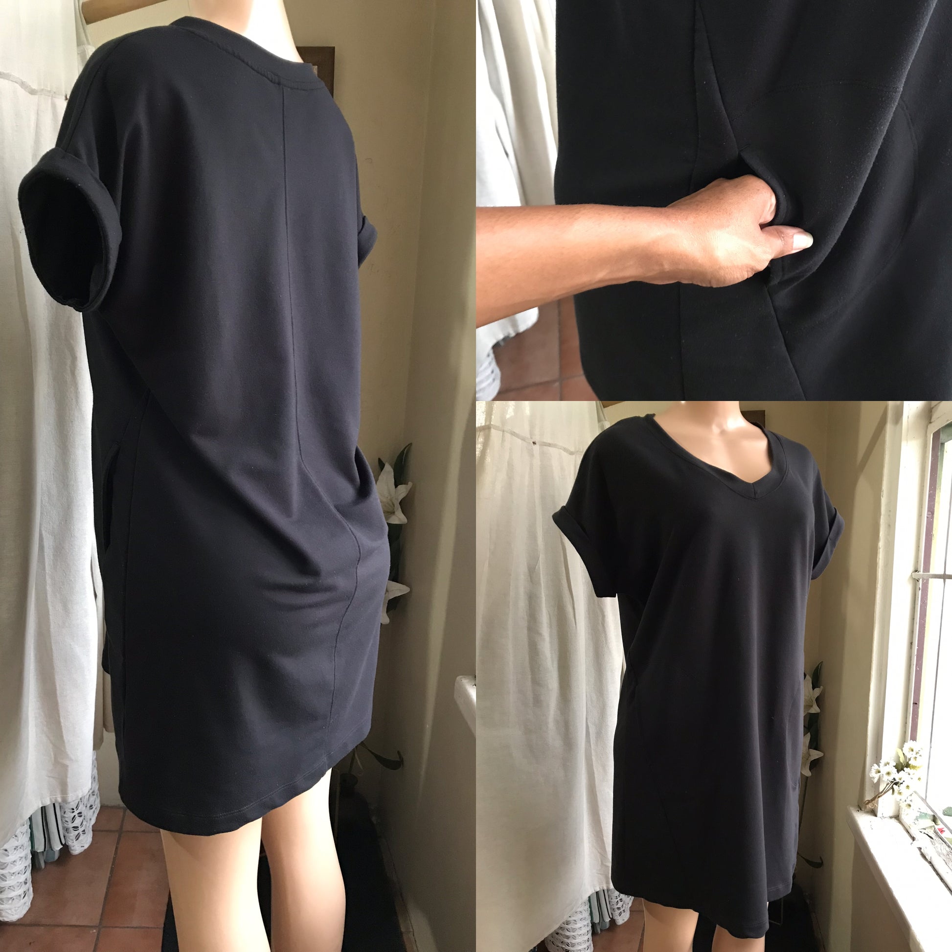 black cuffed tee dress with pockets and diagonal seam . m