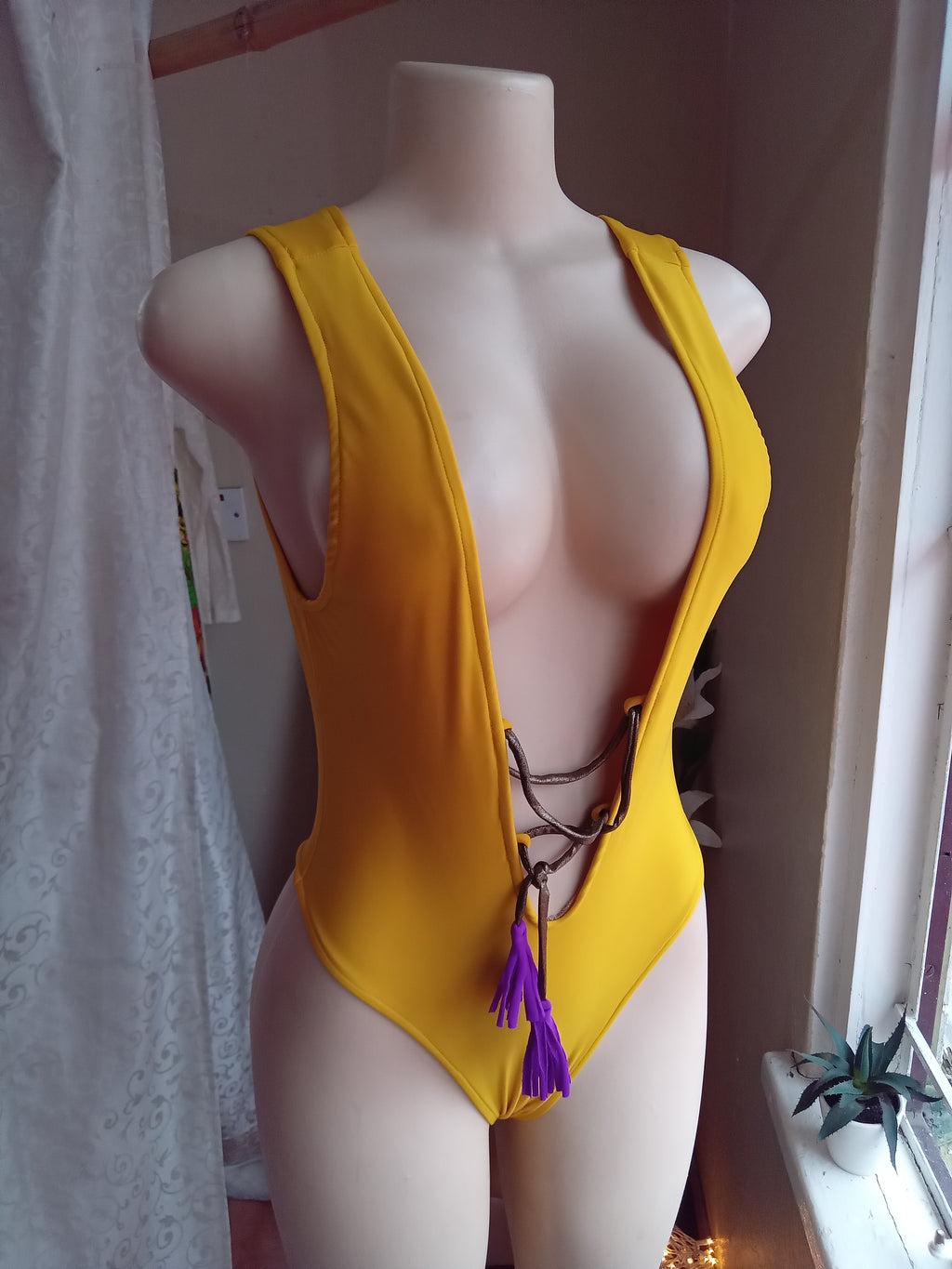 Like new Locally made one piece swim suit purple tassel .. S